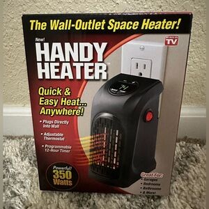 Handy Heater Wall Outlet Space Heater 
New In Box
